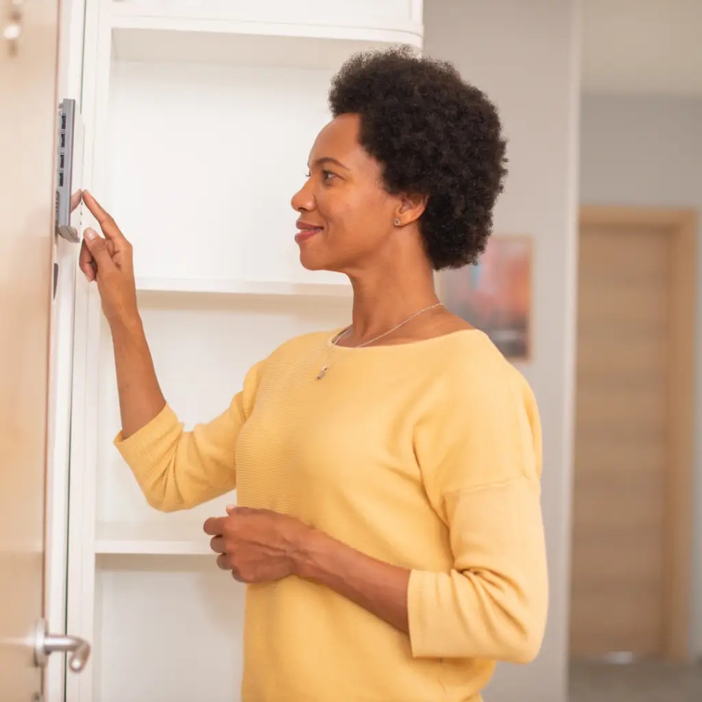 Lady opening the gate with home automation
